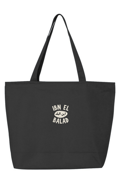 Black tote bag with 'Ibn El Balad' logo on a white background